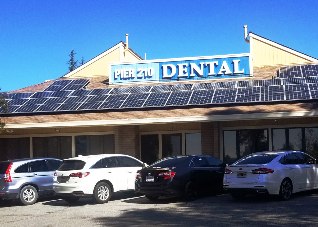 Solar panels installed on the roof of Pier 210 Dental provide all the electricity they need to operate their busy practice.