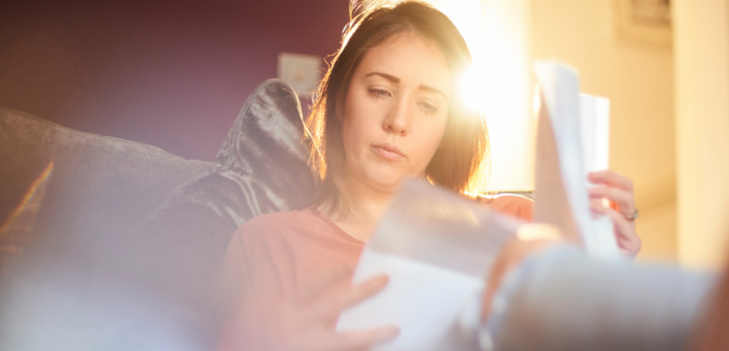 Woman reviewing her PG&E True-Up Bill.