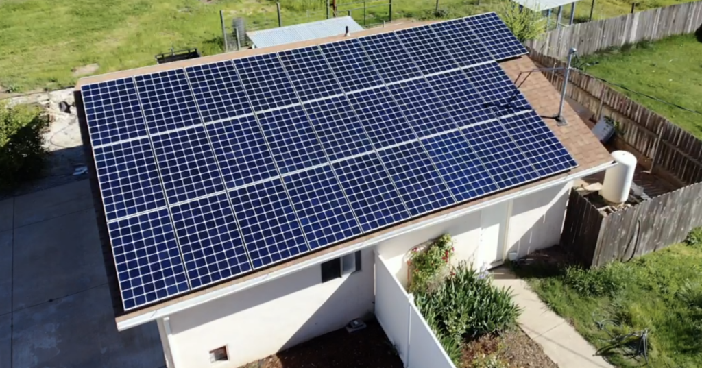 Home with solar panels attached to the roof.