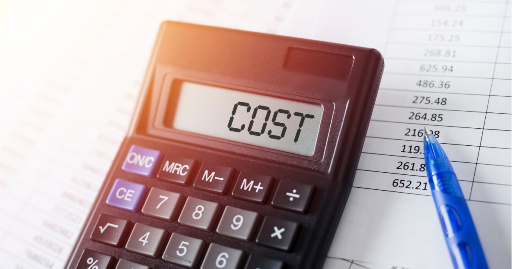 Calculator that says “COST,” representing the cost-benefit analysis of solar installations