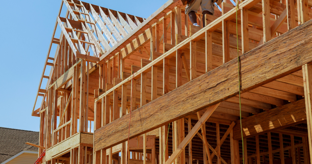 A wooded frame home is being built.