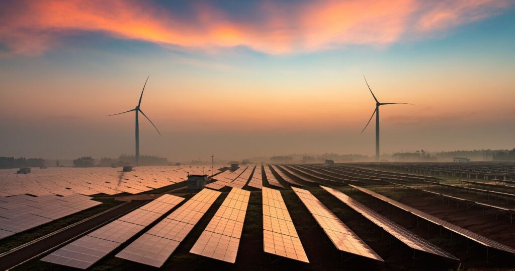 A field of solar panels during sunset, showing the power of solar and smart technology.